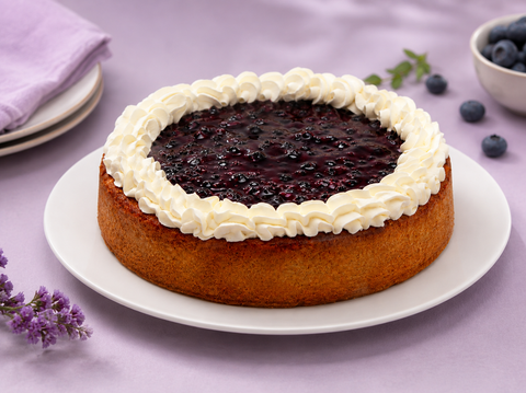 Pay de queso con mora de Pastelerías Marisa, postre artesanal con relleno cremoso de queso y cobertura de mora.