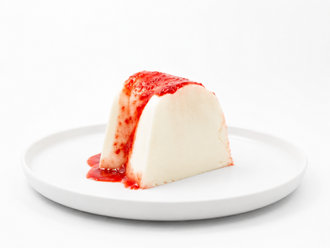 Gelatina delicia de yogurt de Pastelerías Marisa, postre artesanal de yogurt con cobertura de frutos rojos y textura cremosa.